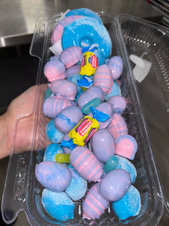 Colorful candy-coated fruit boat display